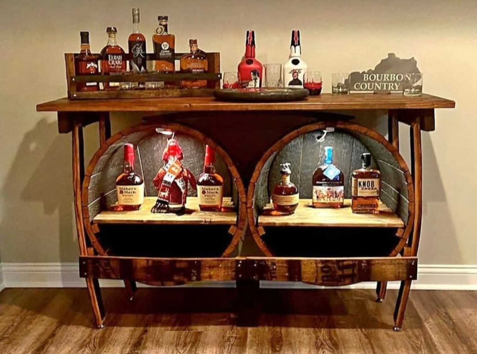 Bourbon barrel bar cabinet with shelving and bottles